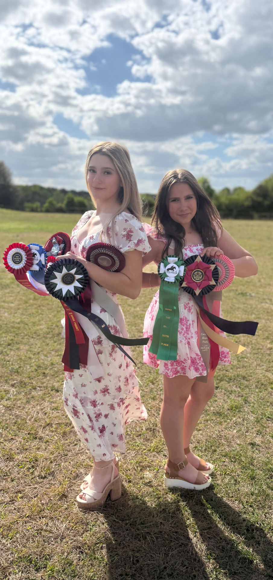 Violet Love and Victoria Grace holding show ribbons